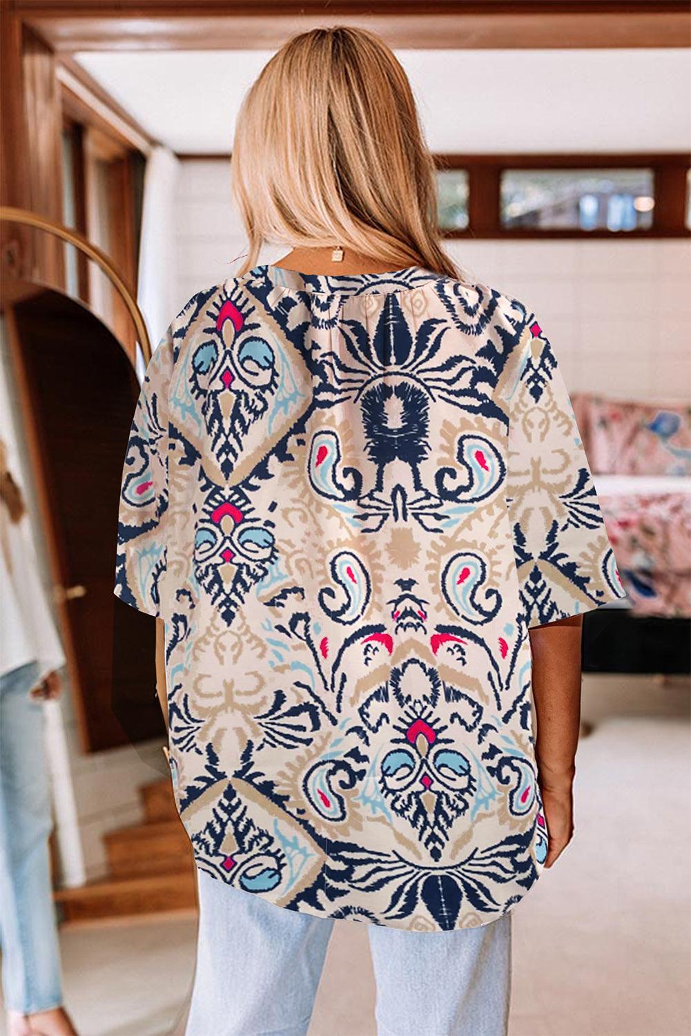 White abstract printed V neck blouse, back view