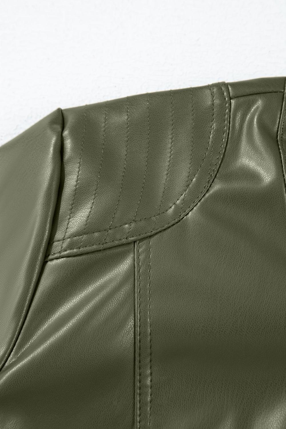 Shoulder stitching detail on sage green jacket