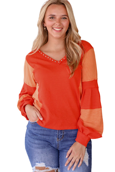 Fiery Red Studded V Neckline Exposed Seam Textured Knit Top