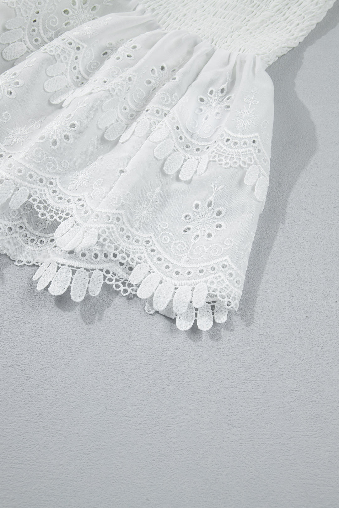 White Sleeveless Smocked Lace Peplum Top