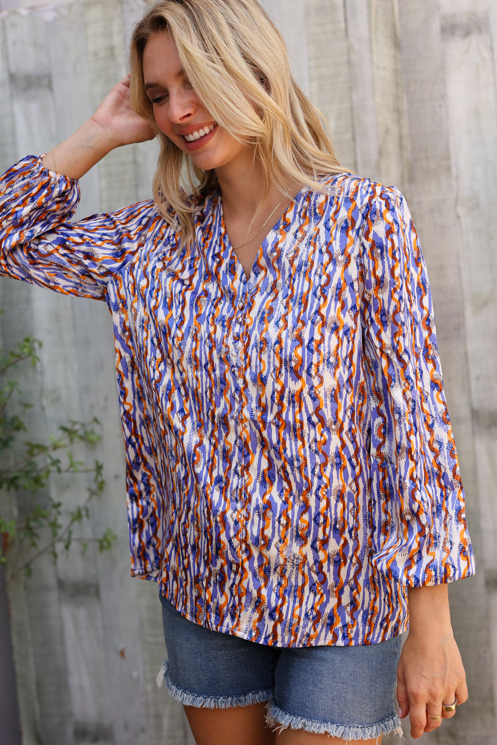 On A Wild Streak V Neck Fabric Button Detail Blouse