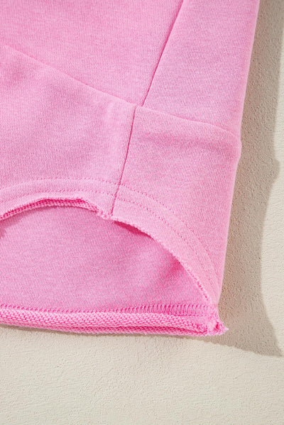 Hem detail of sachet pink loose sweatshirt