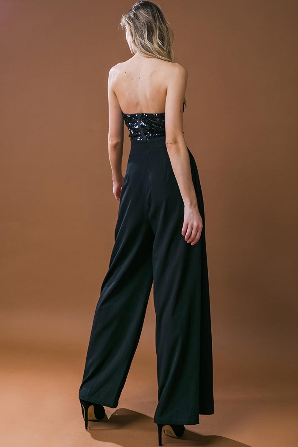 Back view of black sequin tube top jumpsuit on model