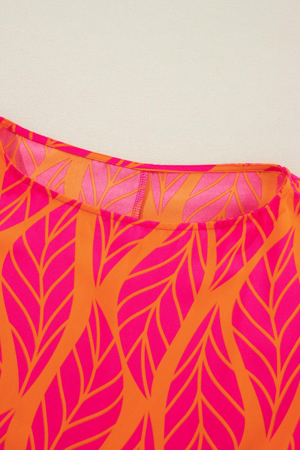 Close-up of neckline on tropical leaf print blouse