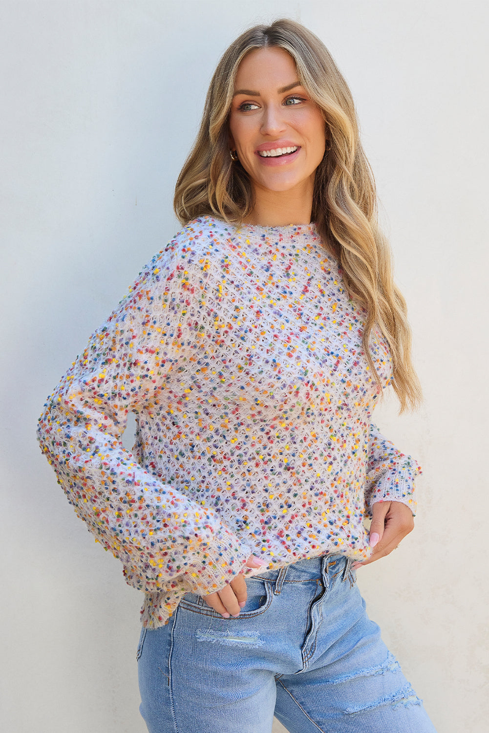 Side view of white confetti knit popcorn sweater top