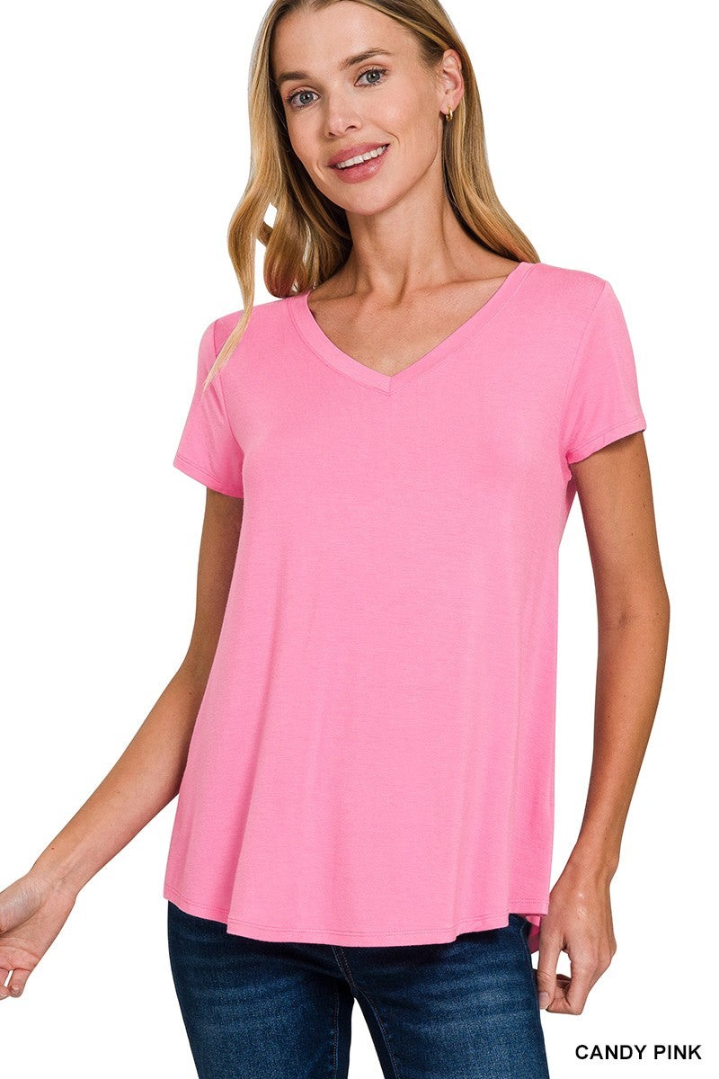 Woman wearing a pink t-shirt with a white background
