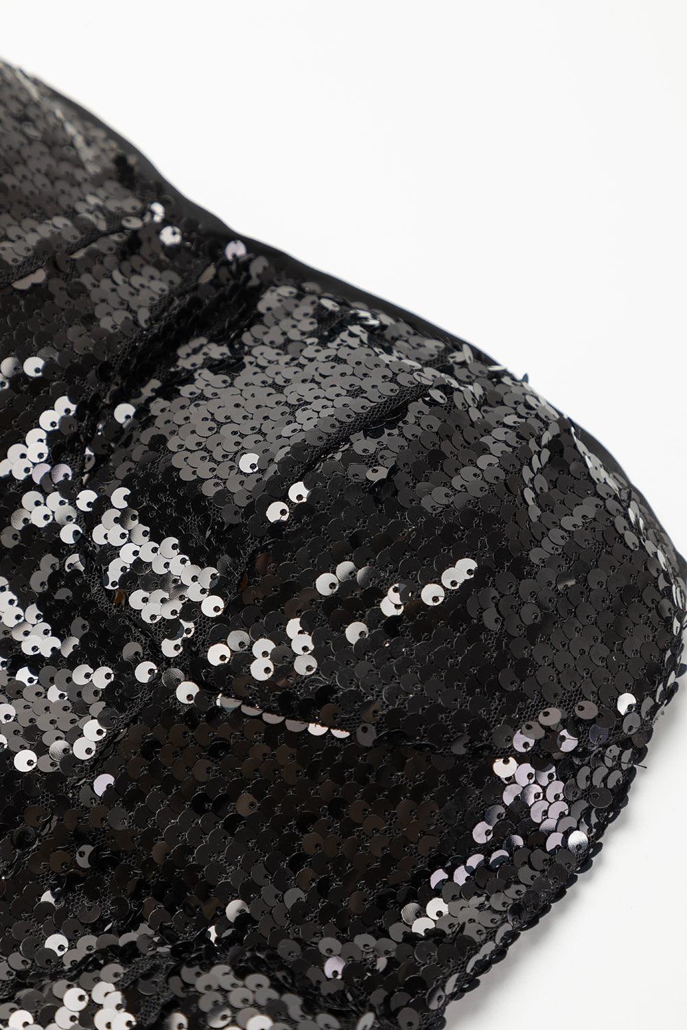 Close-up of sequin detail on black jumpsuit