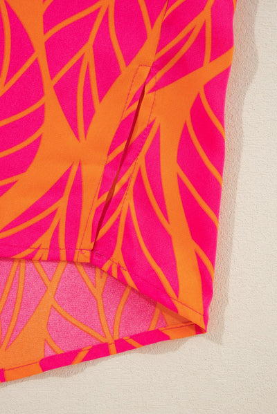 Hem detail of tropical leaf print blouse