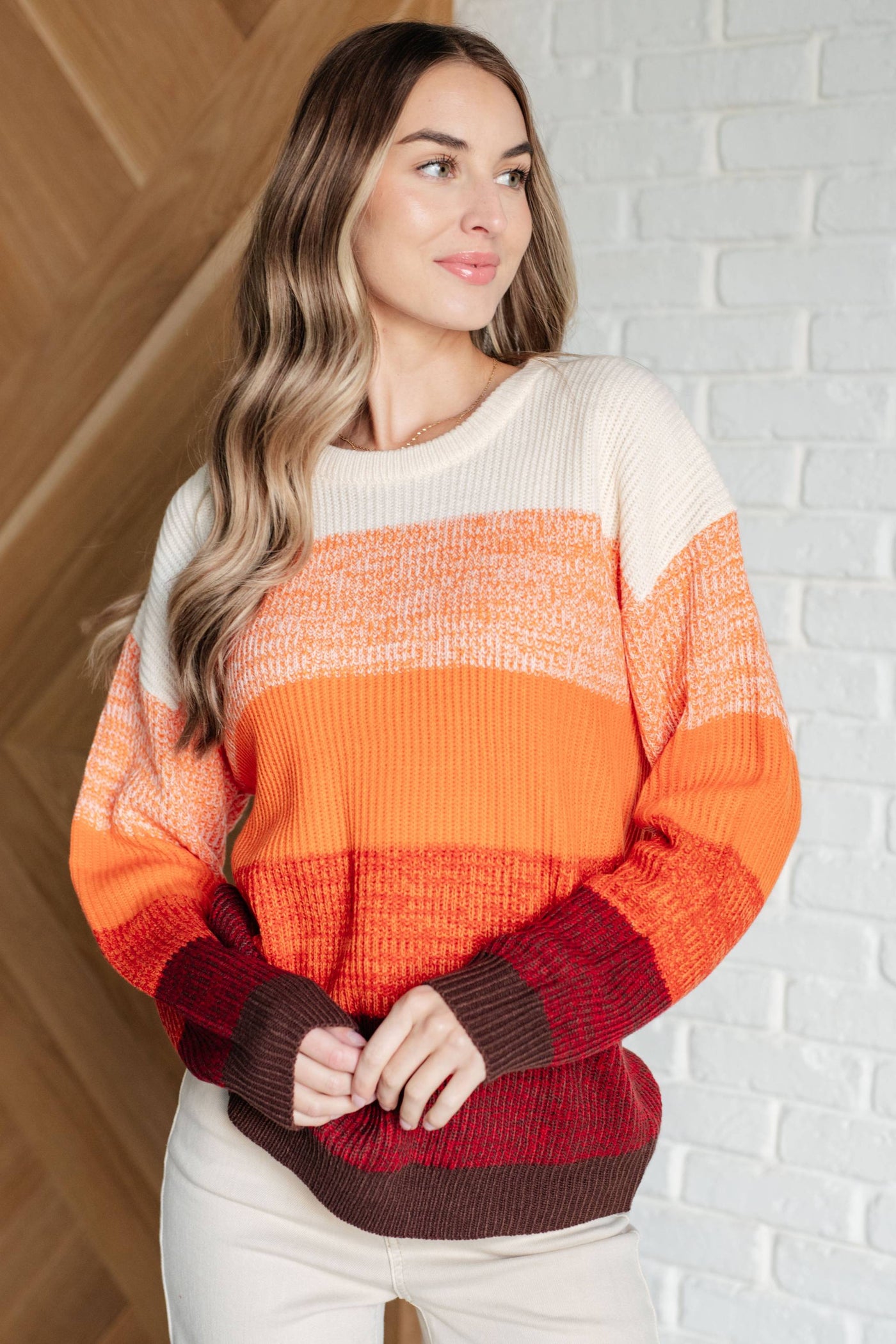 All Too Well color block sweater in warm tones, worn by model.