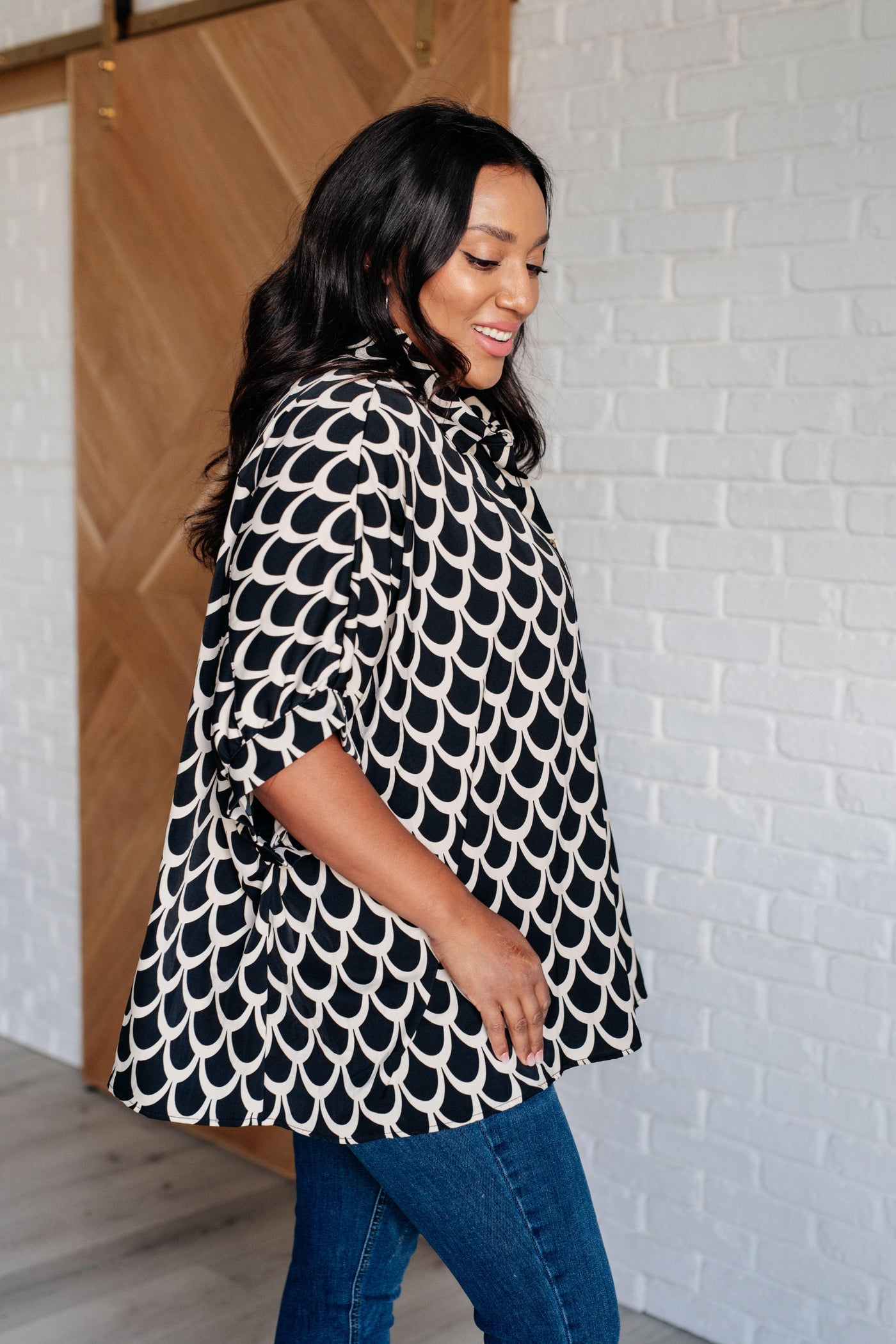 Side view of Art Deco button-up blouse with bold pattern