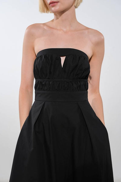 Close-up of black strapless woven midi dress top