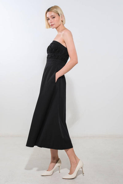 Side view of black strapless woven midi dress