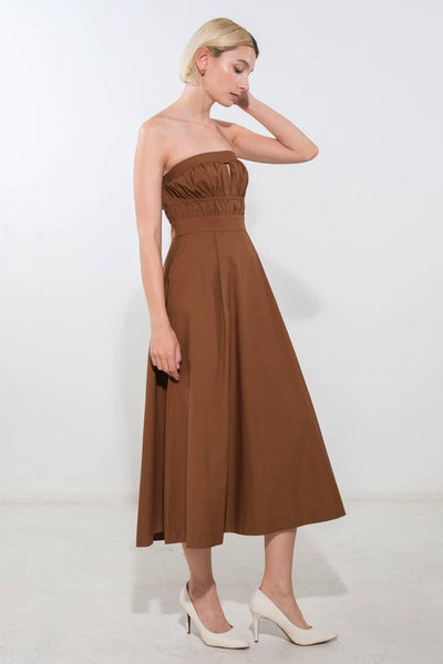 Side view of brown strapless woven midi dress