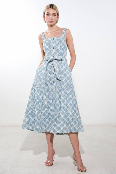 Light denim midi dress with button front and pockets.