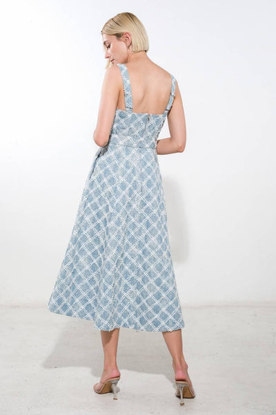 Back view of light denim midi dress with straps.