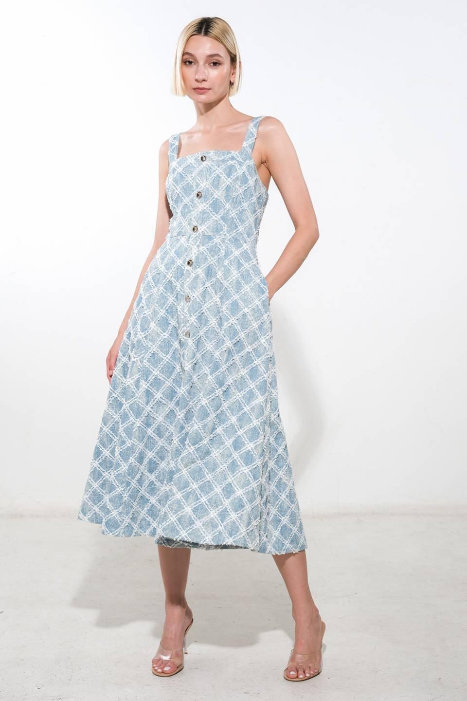 Front view of light denim midi dress with button details.