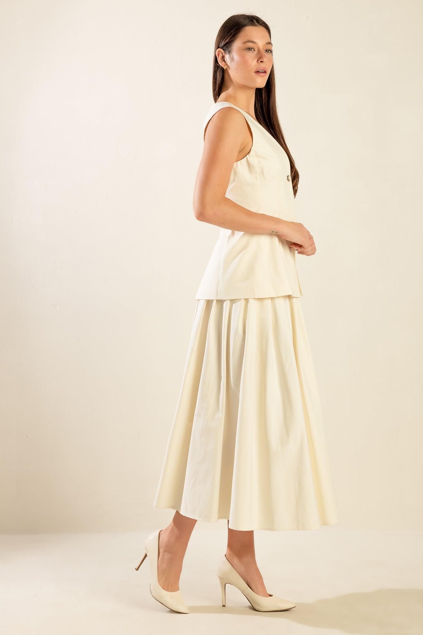 Cream woven vest with pleated skirt, side view