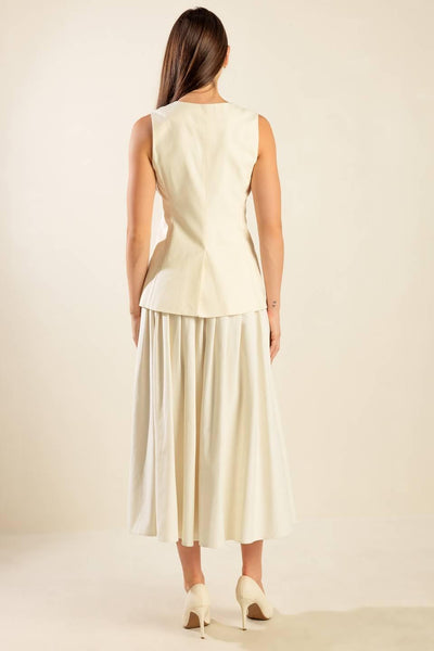 Back view of cream woven vest and skirt