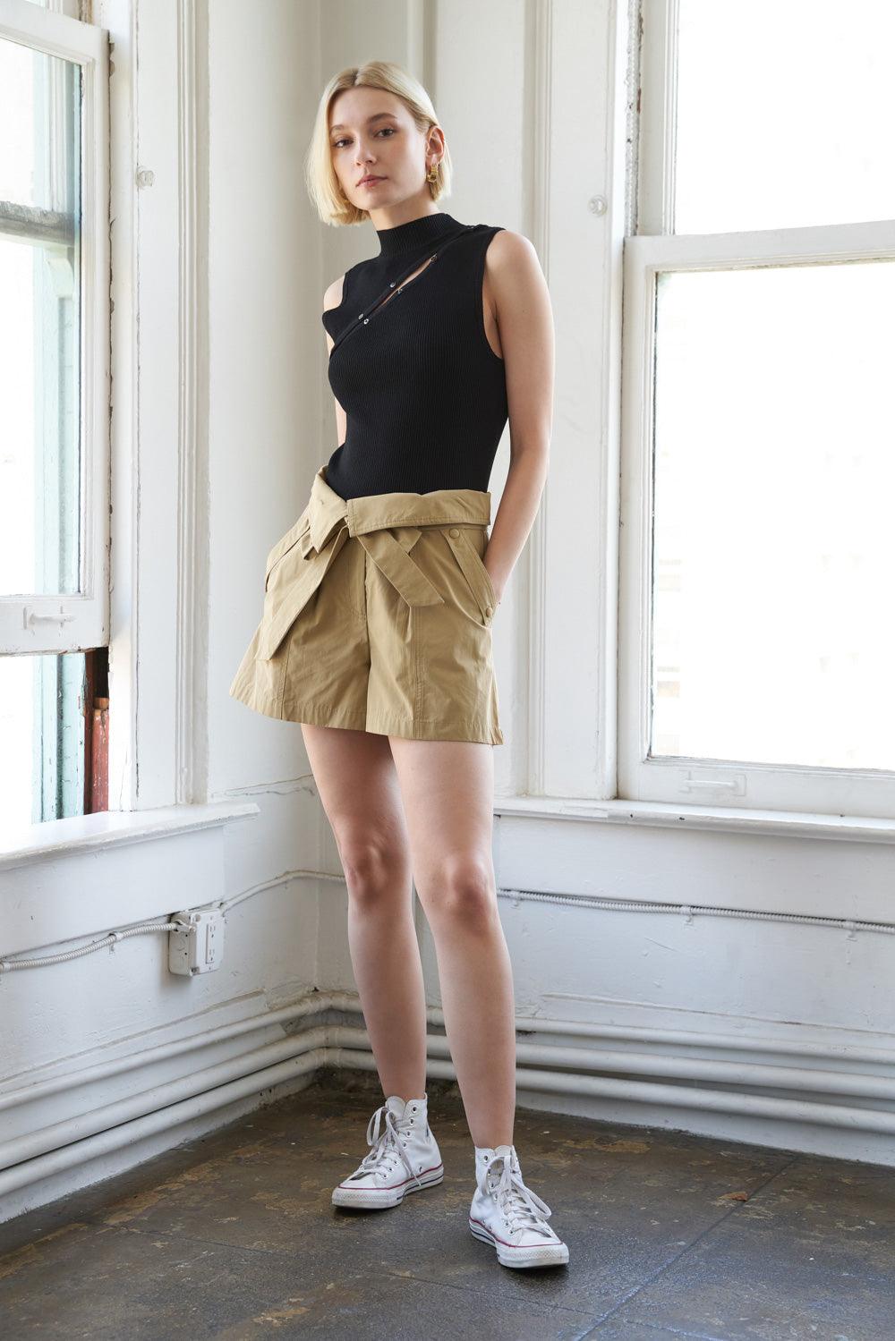 Camel woven shorts with front tie detail, styled with black top.