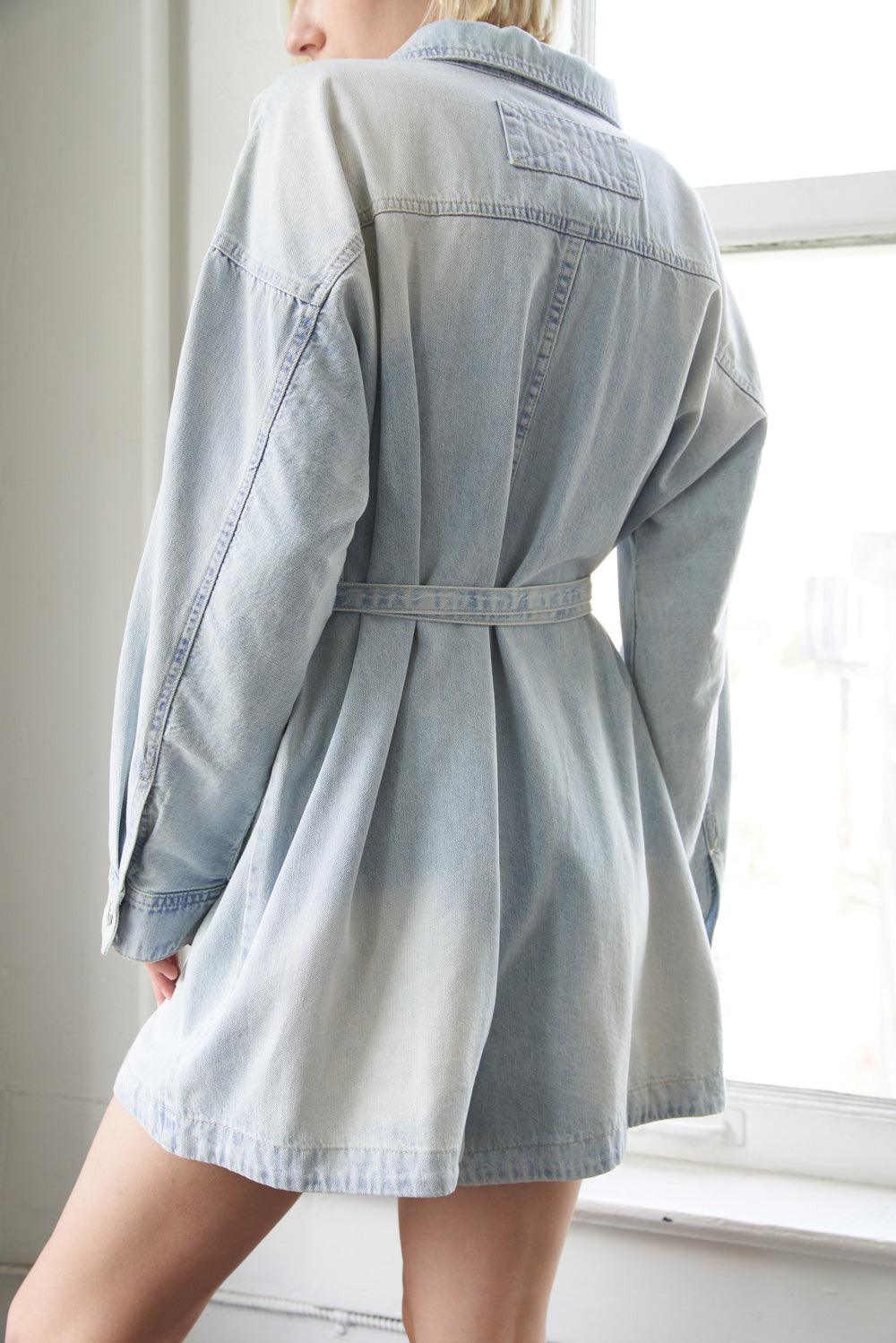 Light indigo denim romper with belt, back detail.