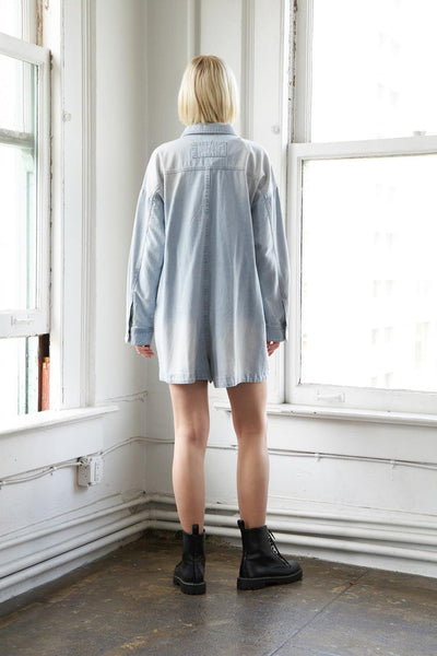 Light indigo denim romper, back view.