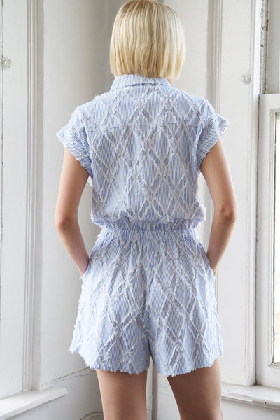 Sky blue woven romper with diamond pattern, back view