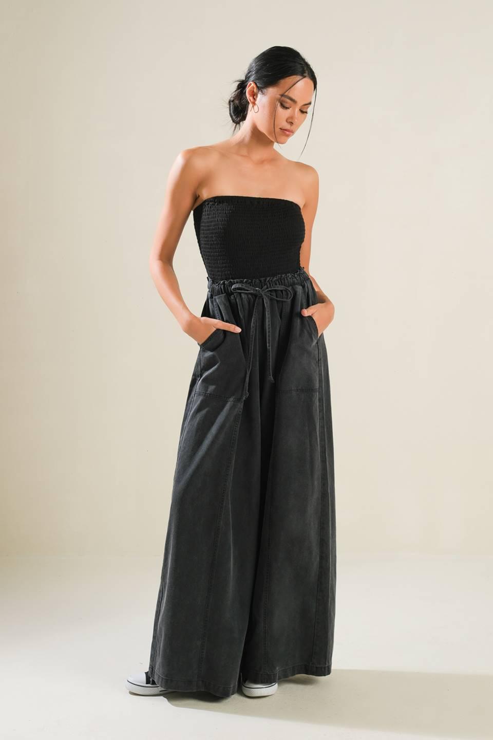 Black strapless jumpsuit with wide-leg pants, front view.