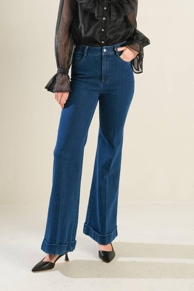 Front view of medium indigo denim pants