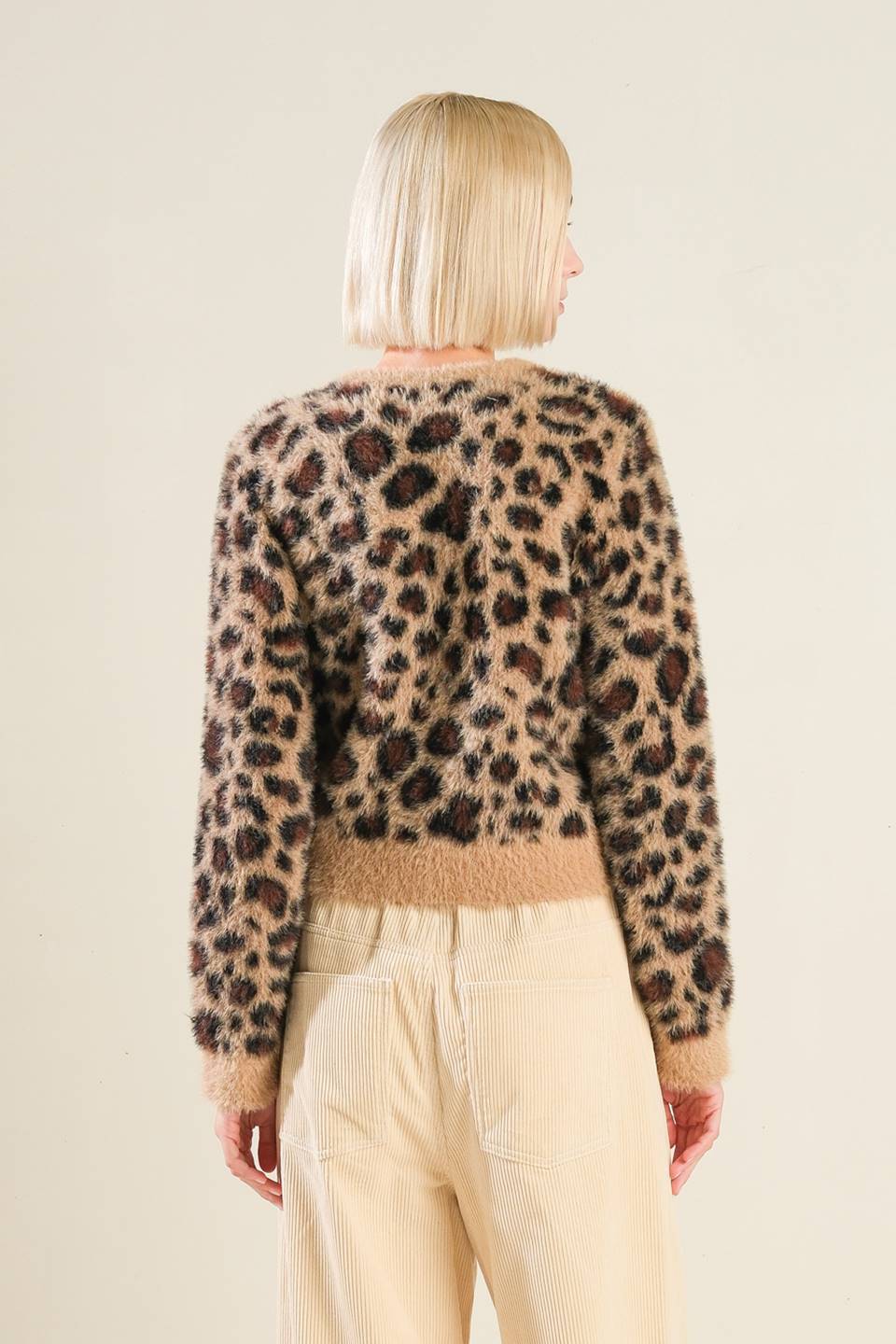 Back view of taupe/black leopard print sweater cardigan