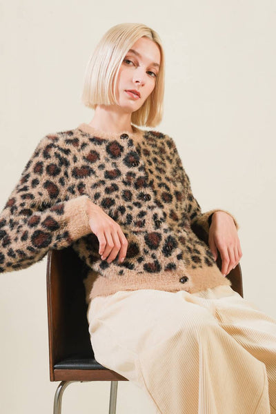 Taupe/black leopard print sweater cardigan, seated view