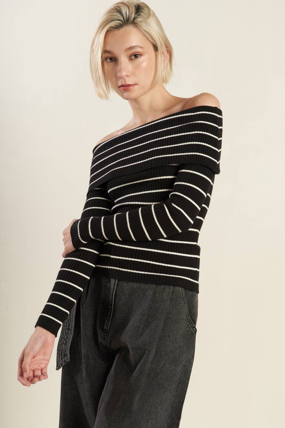 Black and white striped off-shoulder sweater top, front view