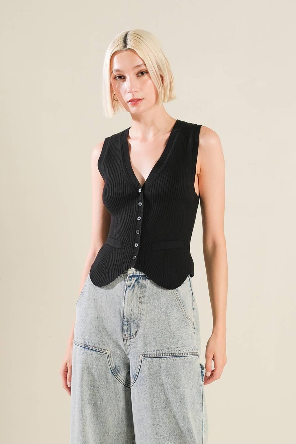 Front view of Regal Rise black knit vest with jeans