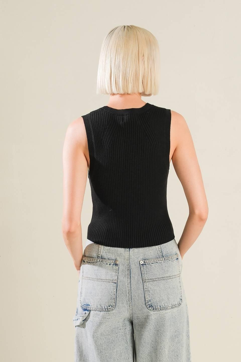 Back view of Regal Rise black knit vest with jeans