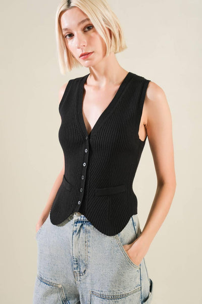 Close-up of Regal Rise black knit vest with jeans