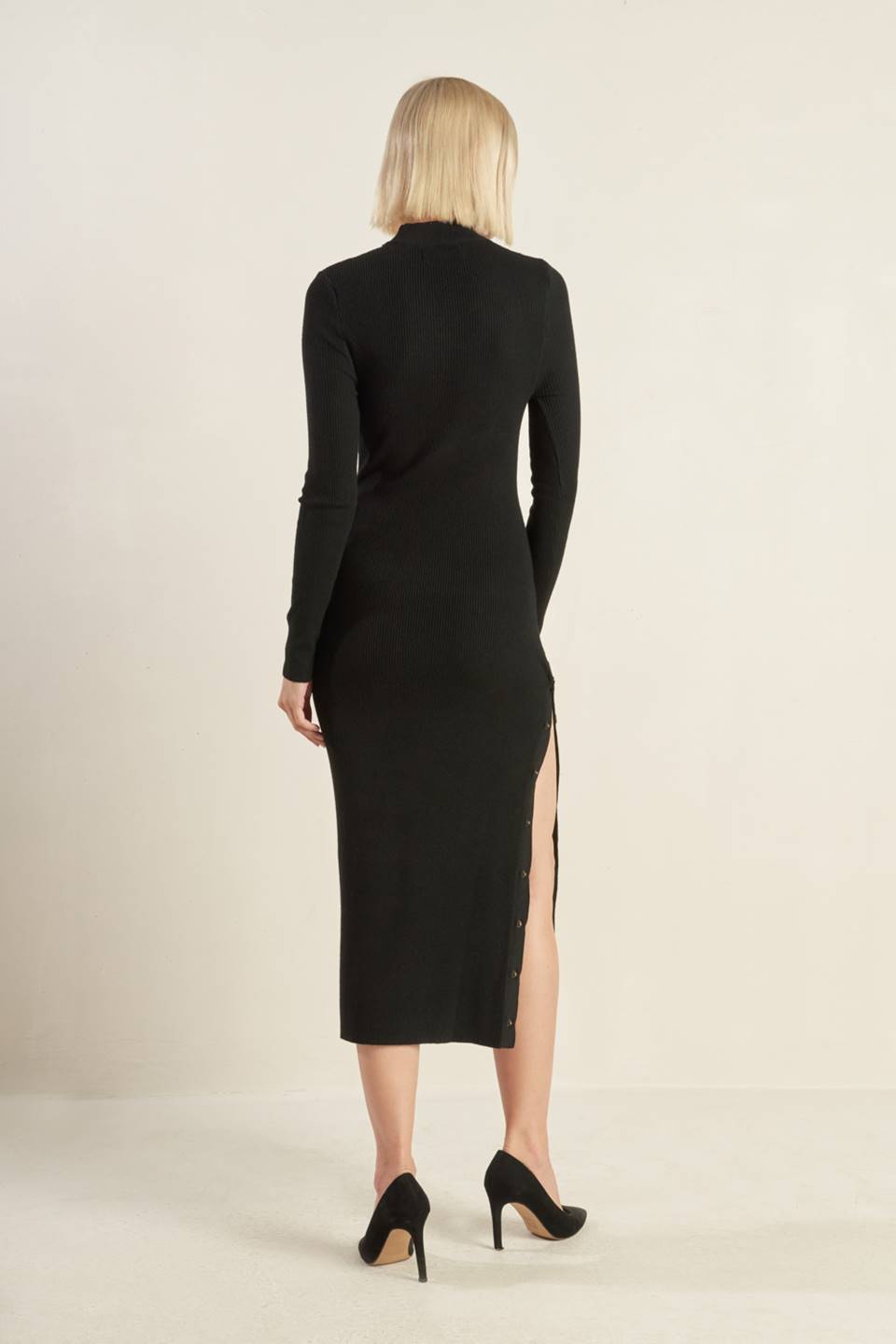 Black sweater midi dress with side buttons, back view