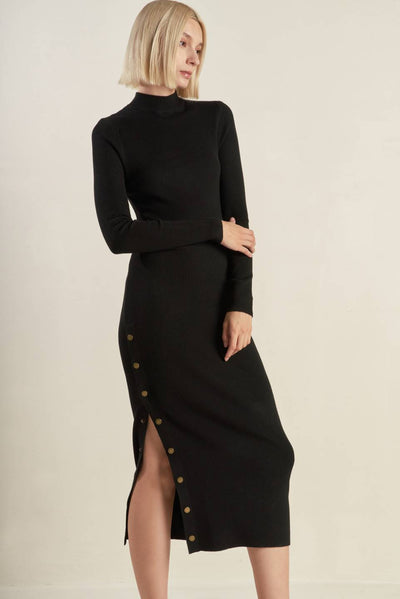 Black sweater midi dress with side buttons, elegant pose