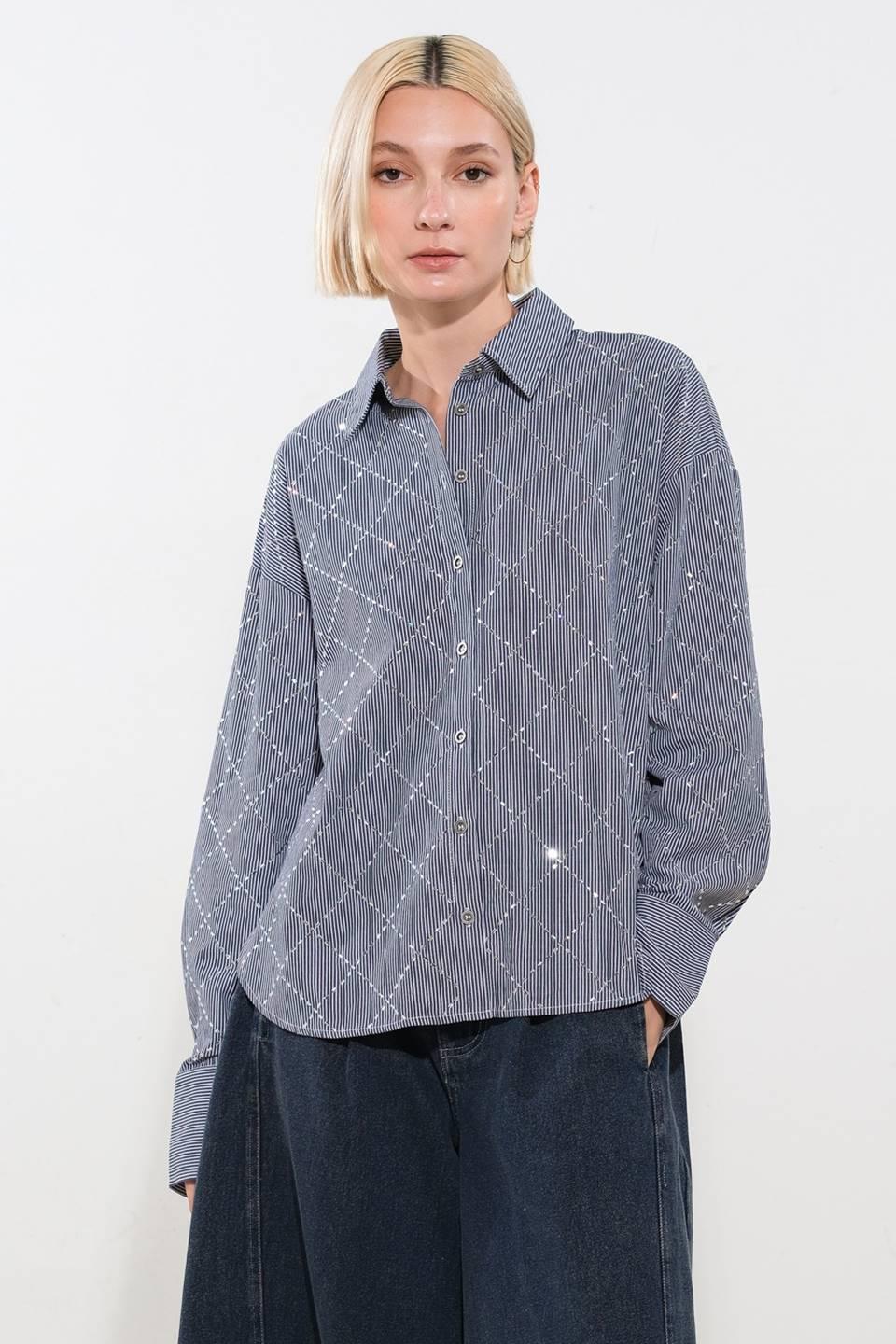 Front view of graceful navy and white woven top.