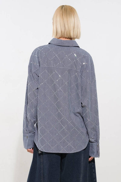 Back view of navy and white woven top with subtle pattern.