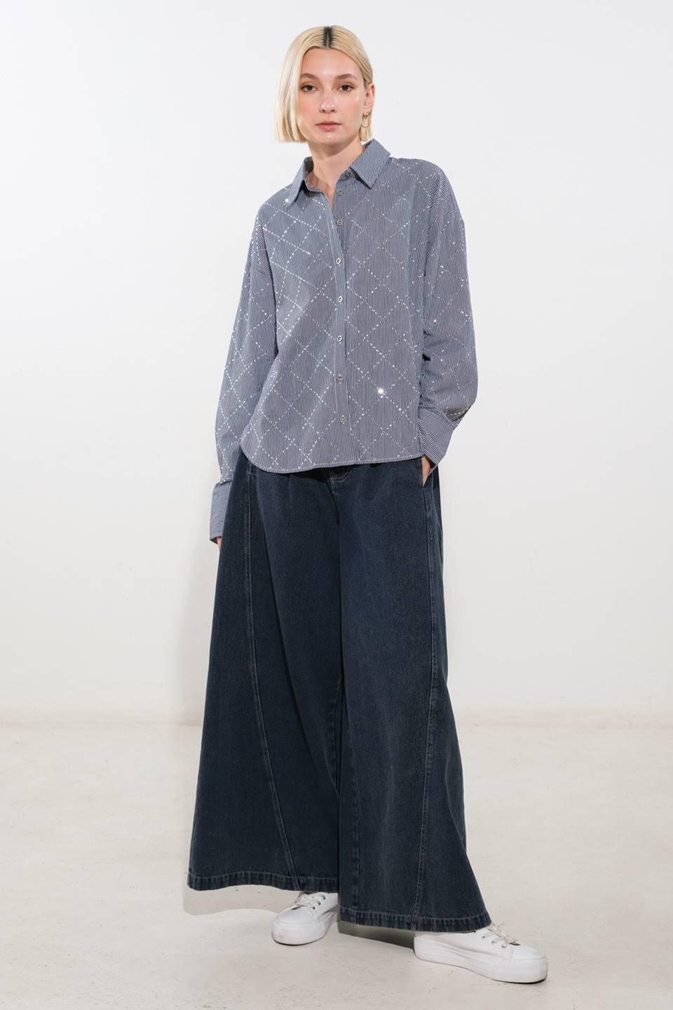 Navy and white woven top styled with wide-leg jeans.