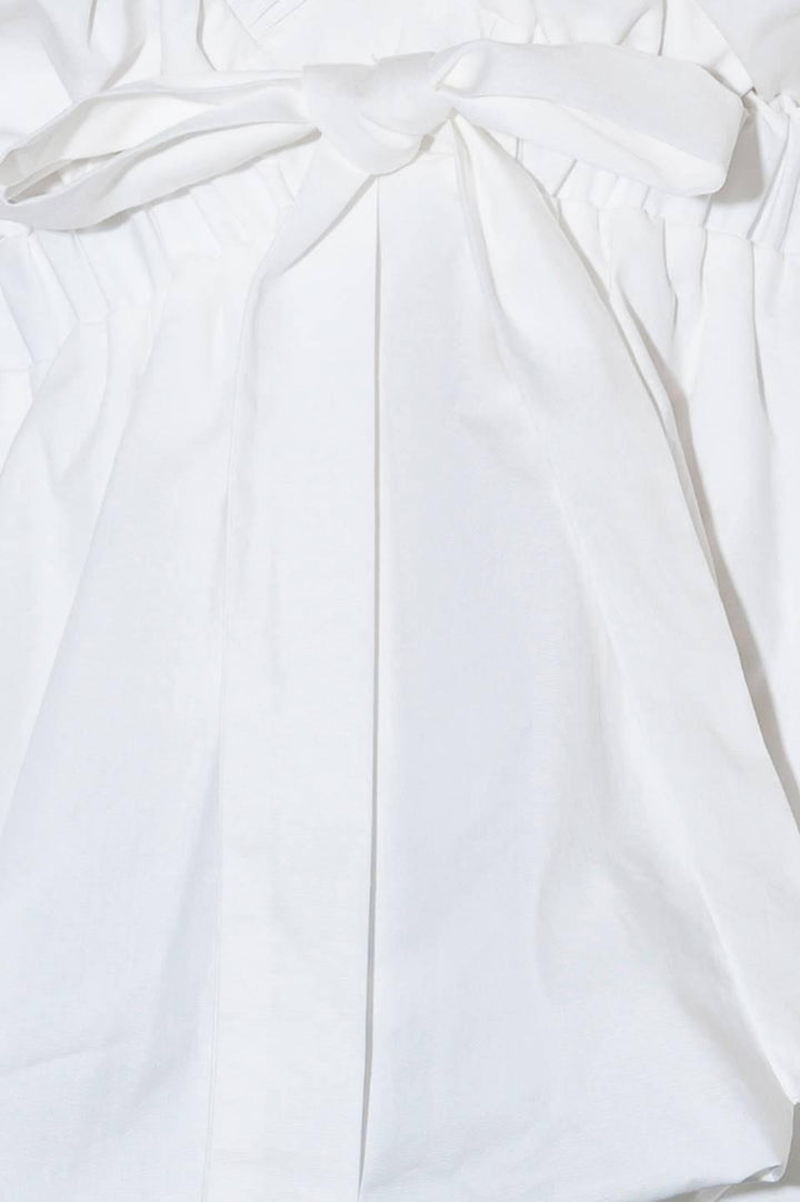 SLOW DOWN IN WHITE WOVEN TOP