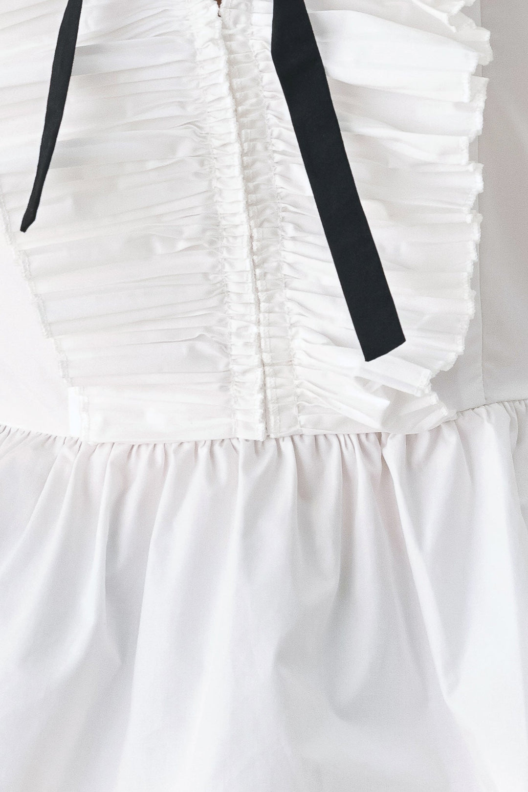 AMELIE PLEATED RUFFLE V-NECK WOVEN TOP