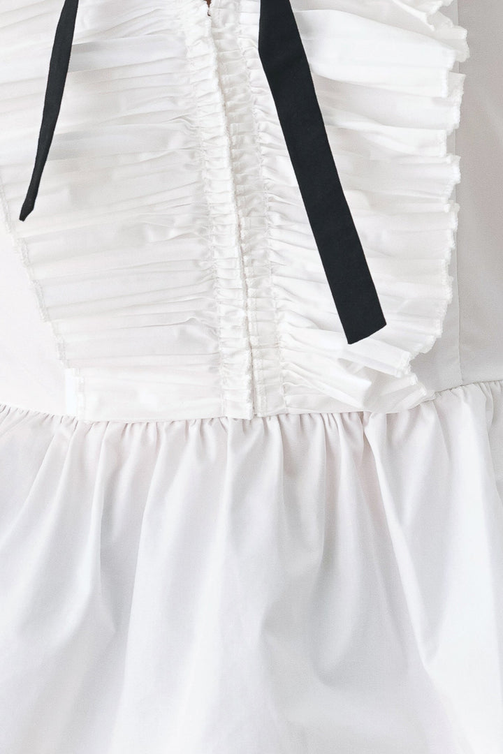 AMELIE PLEATED RUFFLE V-NECK WOVEN TOP