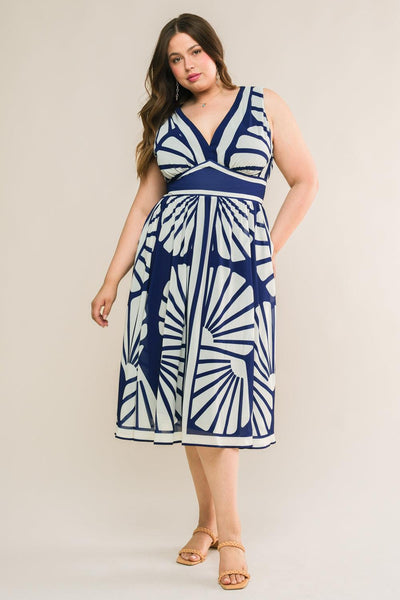 Plus-size model in navy woven midi dress with white patterns