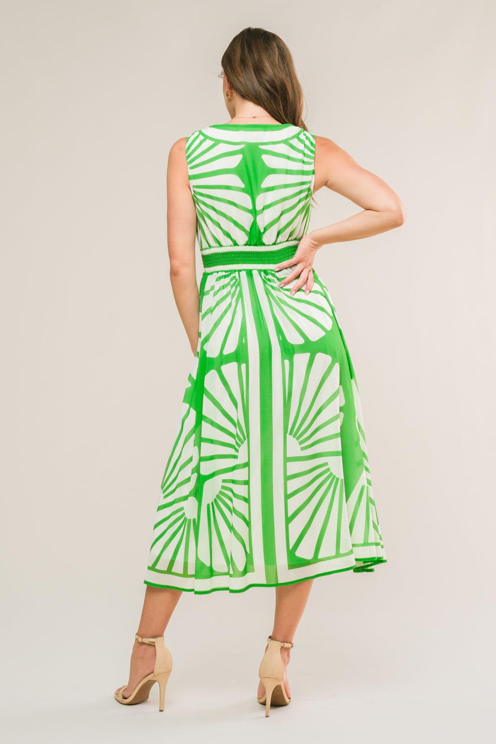 Back view of green woven midi dress with white patterns