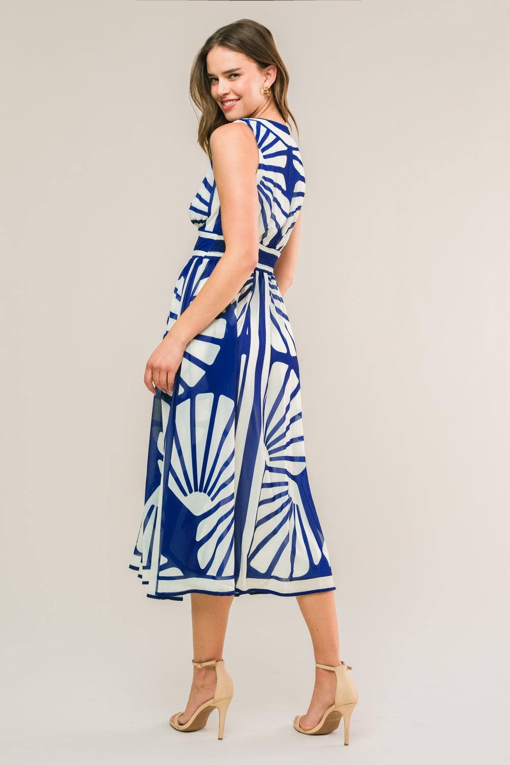 Side view of navy woven midi dress with white patterns