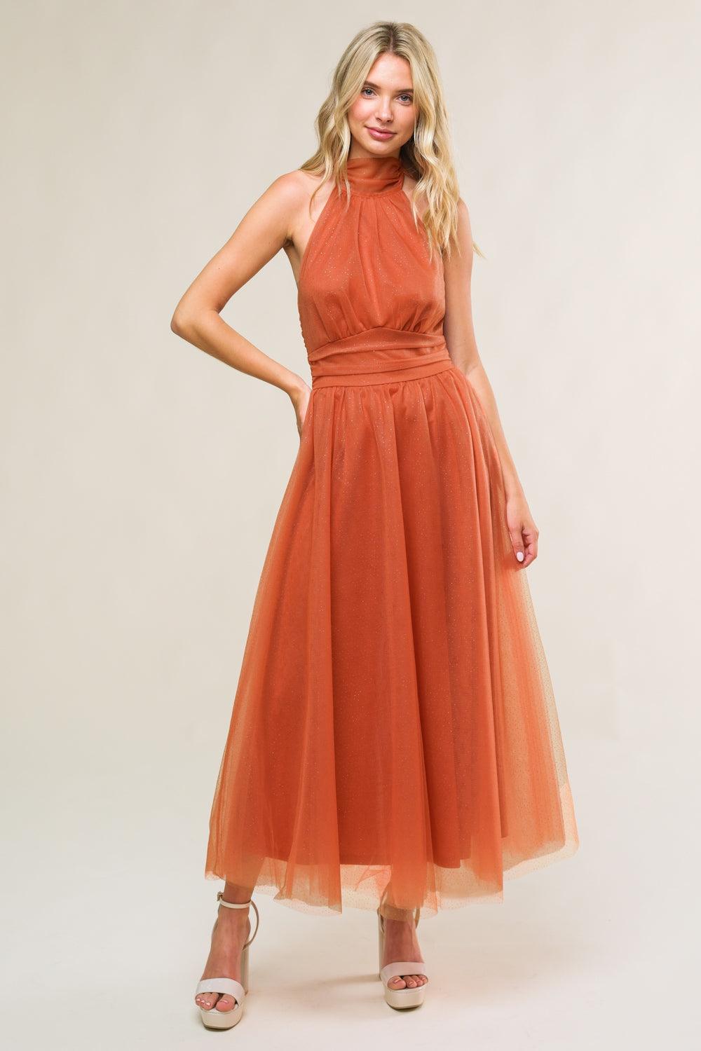 Rust mesh midi dress with halter neck, side view