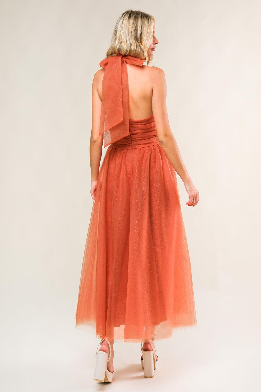 Rust mesh midi dress with halter neck, back view