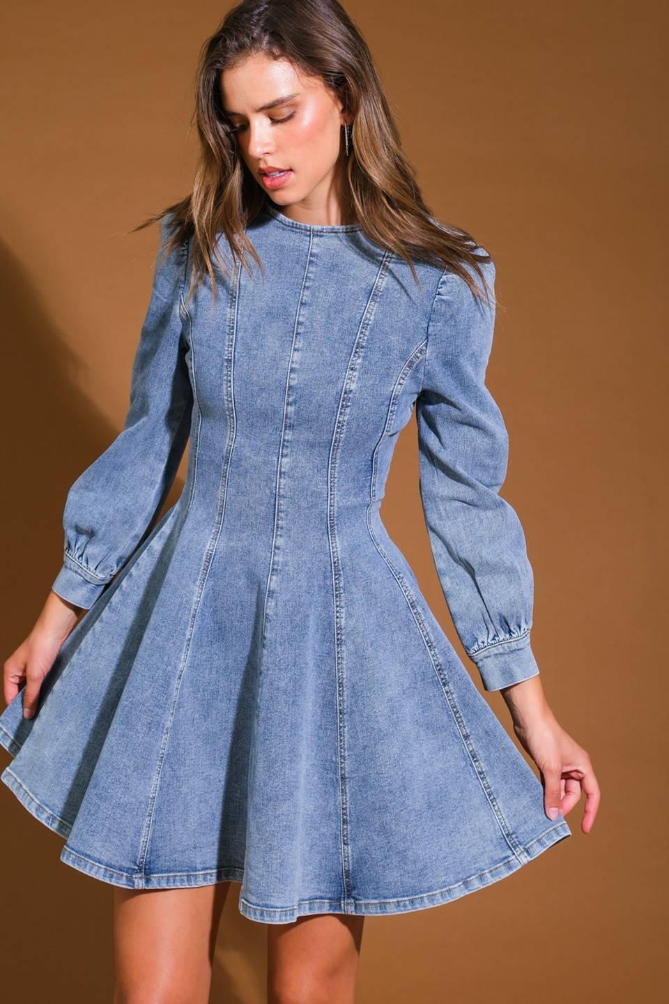 Close-up of blue acid wash denim mini dress