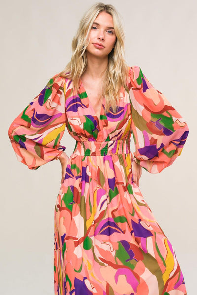 Close-up of peach maxi dress with colorful abstract print