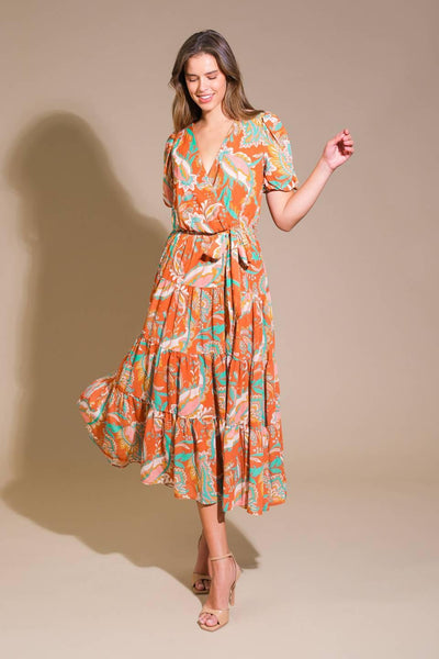 Rust woven midi dress, model twirling, side view